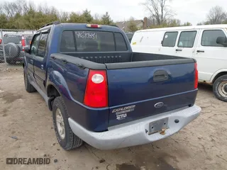 2005 Ford Explorer Sport Trac XLS with VIN 1FMZU77K35UA59213, listed as a IAAI auction lot 41690884 with 219,652 mi miles. Bid and sale history available at carsss.com. Image 3.