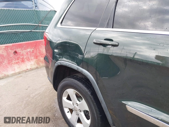 2011 Jeep Grand Cherokee 70th Anniversary with VIN 1J4RR4GG3BC631831, listed as a IAAI auction lot 42038415 with 130,811 mi miles. Bid and sale history available at carsss.com. Image 6.