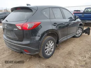 2015 Mazda CX-5 Sport with VIN JM3KE4BY9F0495948, listed as a IAAI auction lot 41501840 with 145,959 mi miles. Bid and sale history available at carsss.com. Image 4.