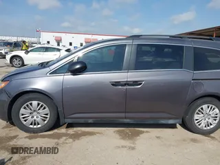 2015 Honda Odyssey LX with VIN 5FNRL5H29FB032327, listed as a IAAI auction lot 42052043 with 153,365 mi miles and . Bid and sale history available at DreamBid. Image 14.
