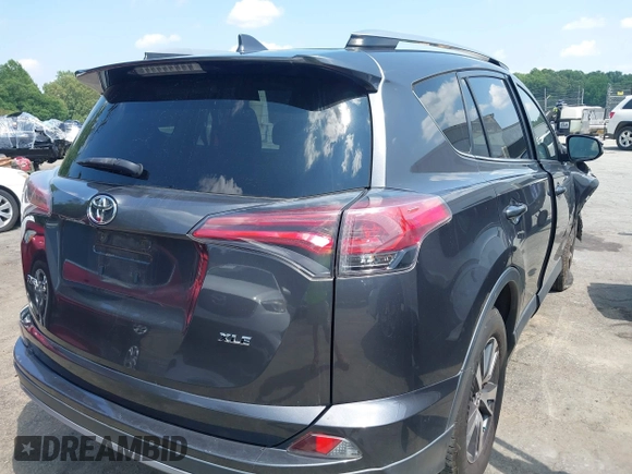 2018 Toyota RAV4 XLE with VIN JTMWFREV9JJ201845, listed as a IAAI auction lot 42442303 with 111,177 mi miles and . Bid and sale history available at DreamBid. Image 4.
