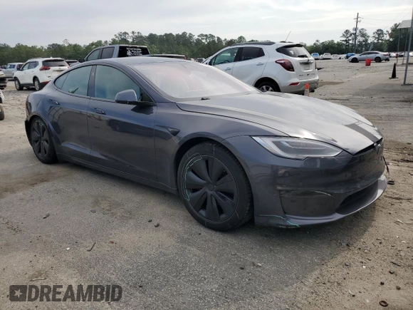 2022 Tesla Model S with VIN 5YJSA1E5XNF471212, listed as a Copart auction lot 57384025 with Not provided miles and Salvage title. Bid and sale history available at DreamBid. Image 4.
