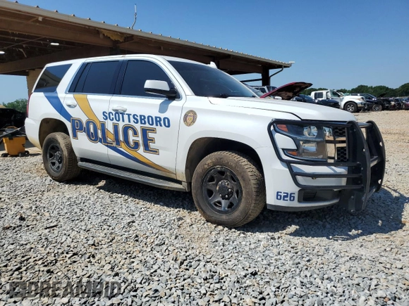 2018 Chevrolet Tahoe Commercial with VIN 1GNLCDEC1JR244940, listed as a Copart auction lot 54713275 with 99,661 mi miles and Salvage title. Bid and sale history available at DreamBid. Image 4.