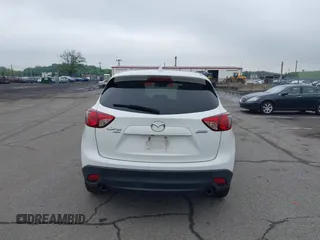 2015 Mazda CX-5 Grand Touring with VIN JM3KE4DY5F0530854, listed as a IAAI auction lot 42274582 with 144,732 mi miles and . Bid and sale history available at DreamBid. Image 16.