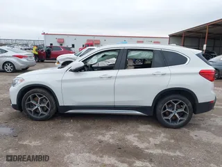 2019 BMW X1 xDrive28i with VIN WBXHT3C51K5L90392, listed as a IAAI auction lot 41571403 with 96,732 mi miles. Bid and sale history available at carsss.com. Image 14.