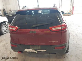2016 Jeep Cherokee Trailhawk with VIN 1C4PJMBBXGW135138, listed as a IAAI auction lot 41595718 with 267,058 mi miles. Bid and sale history available at carsss.com. Image 16.