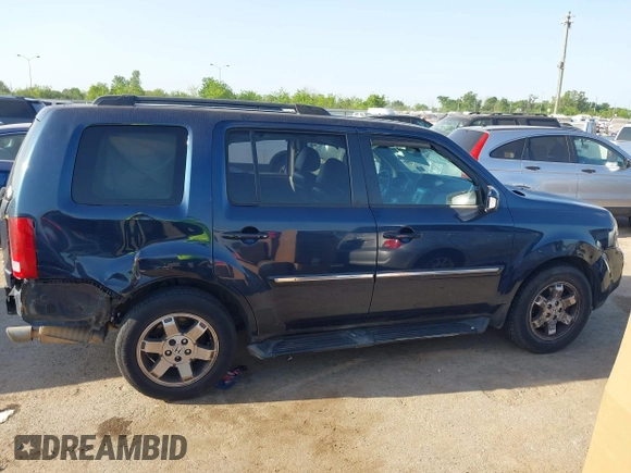 2011 Honda Pilot Touring with VIN 5FNYF4H92BB090056, listed as a IAAI auction lot 42010682 with 201,640 mi miles. Bid and sale history available at carsss.com. Image 13.