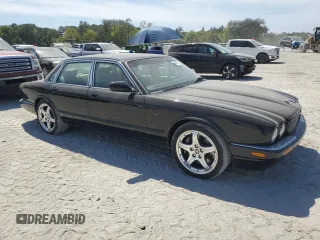 2003 Jaguar XJ with VIN SAJDA15B83MF58887, listed as a Copart auction lot 51057895 with 189,770 mi miles and Clean title. Bid and sale history available at DreamBid. Image 4.