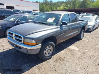 2002 Dodge Dakota SLT with VIN 1B7HG48NX2S623588, listed as a IAAI auction lot 41793068 with 213,159 mi miles. Bid and sale history available at carsss.com. Image 2.