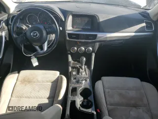 2016 Mazda CX-5 Touring z VIN JM3KE2CYXG0683673, wystawiony jako Copart lot #56724025 z przebiegiem 107 293 mil mil oraz Szkoda całkowita • Salvage title. Historia ofert i sprzedaży dostępna na DreamBid. Obrazek 8.