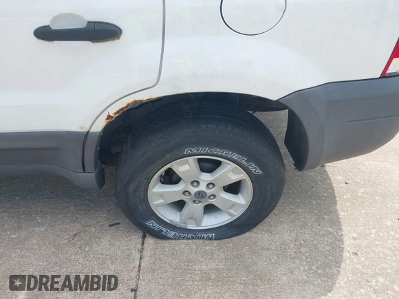 2006 Ford Escape XLT z VIN 1FMCU03106KA68555, wystawiony jako IAAI lot #42639823 z przebiegiem 147 320 mil mil oraz . Historia ofert i sprzedaży dostępna na DreamBid. Obrazek 6.