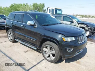 2015 Jeep Grand Cherokee Overland z VIN 1C4RJFCGXFC159387, wystawiony jako IAAI lot #42538792 z przebiegiem 180 652 mil mil oraz . Historia ofert i sprzedaży dostępna na DreamBid. Obrazek 1.