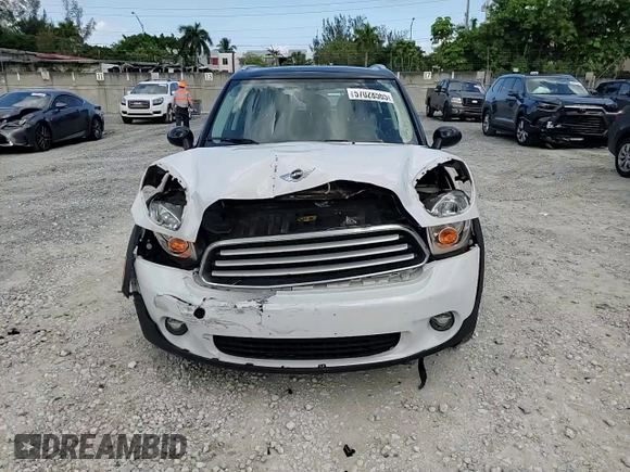 2013 MINI Countryman with VIN WMWZB3C5XDWM31715, listed as a Copart auction lot 57028565 with 95,453 mi miles and Salvage title. Bid and sale history available at DreamBid. Image 13.