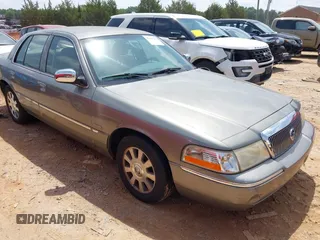 2003 Mercury Grand Marquis LS Premium z VIN 2MEHM75WX3X704496, wystawiony jako IAAI lot #42257767 z przebiegiem 200 885 mil mil oraz . Historia ofert i sprzedaży dostępna na DreamBid. Obrazek 1.