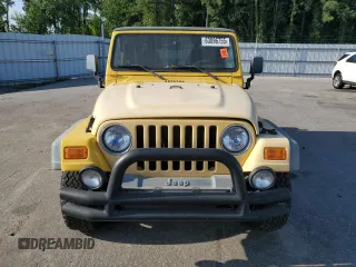 2000 Jeep Wrangler Sport with VIN 1J4FA49SXYP745676, listed as a Copart auction lot 63096755 with 147,226 mi miles and Salvage title. Bid and sale history available at DreamBid. Image 5.