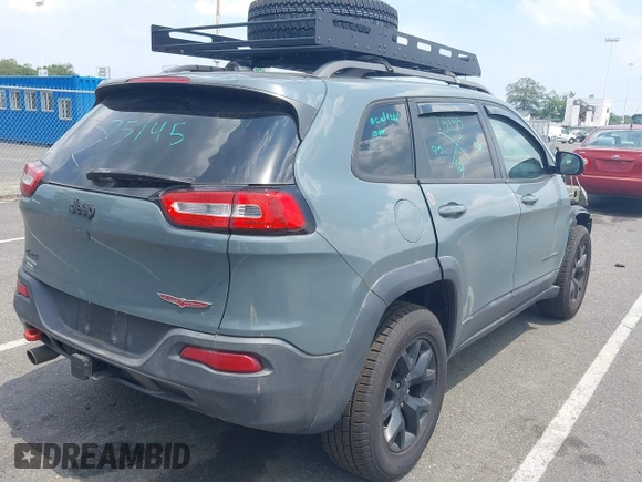 2015 Jeep Cherokee Trailhawk with VIN 1C4PJMBB0FW528421, listed as a IAAI auction lot 42591132 with 166,425 mi miles and . Bid and sale history available at DreamBid. Image 4.