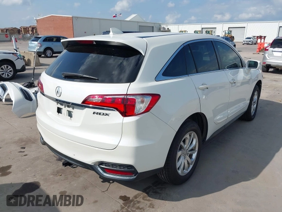 2018 Acura RDX with VIN 5J8TB3H39JL010714, listed as a IAAI auction lot 42128591 with 113,499 mi miles and . Bid and sale history available at DreamBid. Image 4.