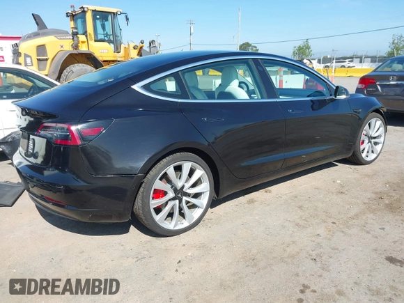 2019 Tesla Model 3 Long Range with VIN 5YJ3E1EB9KF231742, listed as a IAAI auction lot 42114608 with 86,657 mi miles and . Bid and sale history available at DreamBid. Image 4.