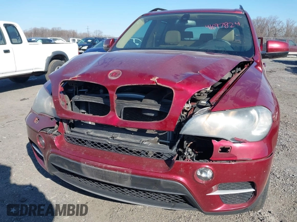 2011 BMW X5 35i with VIN 5UXZV4C52BL413125, listed as a IAAI auction lot 41697824 with 136,828 mi miles. Bid and sale history available at carsss.com. Image 6.