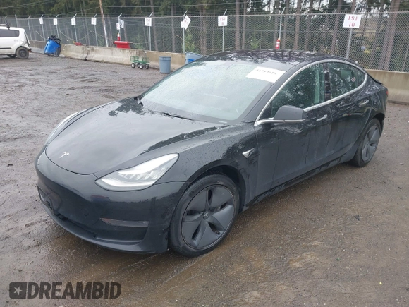 2019 Tesla Model 3 Mid Range with VIN 5YJ3E1EAXKF296378, listed as a IAAI auction lot 41739616 with 77,100 mi miles and . Bid and sale history available at DreamBid. Image 18.
