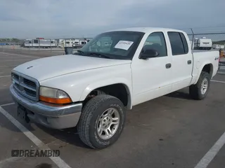 2004 Dodge Dakota SLT with VIN 1D7HG48N44S524998, listed as a IAAI auction lot 42195420 with 197,530 mi miles and . Bid and sale history available at DreamBid. Image 2.