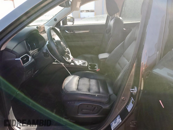 2019 Mazda CX-5 Grand Touring with VIN JM3KFADM8K1634011, listed as a Copart auction lot 57343455 with 67,138 mi miles and Salvage title. Bid and sale history available at DreamBid. Image 7.