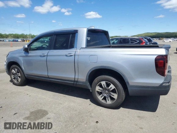 2017 Honda Ridgeline RTL-T with VIN 5FPYK3F65HB012868, listed as a Copart auction lot 57562885 with 115,530 mi miles and Salvage title. Bid and sale history available at DreamBid. Image 2.