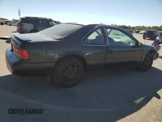 1997 Ford Thunderbird LX z VIN 1FALP62W9VH112212, wystawiony jako Copart lot #75232034 z przebiegiem 138 666 mil mil oraz Szkoda całkowita • Salvage title. Historia ofert i sprzedaży dostępna na DreamBid. Obrazek 3.