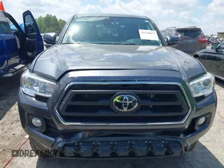 2021 Toyota Tacoma SR z VIN 3TMCZ5AN2MM392590, wystawiony jako IAAI lot #42178072 z przebiegiem 42 542 mil mil oraz . Historia ofert i sprzedaży dostępna na DreamBid. Obrazek 12.
