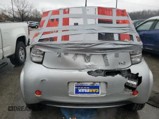 2013 Scion iQ with VIN JTNJJXB08DJ025554, listed as a Copart auction lot 88923885 with 110,378 mi miles and Salvage title. Bid and sale history available at DreamBid. Image 6.
