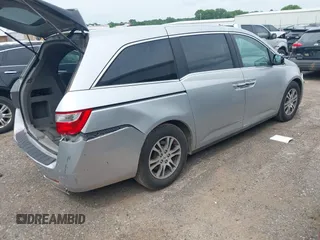 2012 Honda Odyssey EX-L with VIN 5FNRL5H66CB081323, listed as a IAAI auction lot 42465110 with 266,934 mi miles and . Bid and sale history available at DreamBid. Image 4.