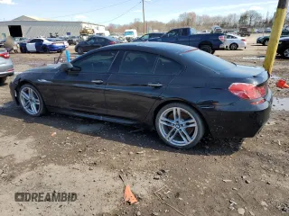 2015 BMW 6 Series 640i with VIN WBA6A0C5XFD318947, listed as a Copart auction lot 50228615 with 78,202 mi miles and Salvage Title. Bid and sale history available at carsss.com. Image 2.