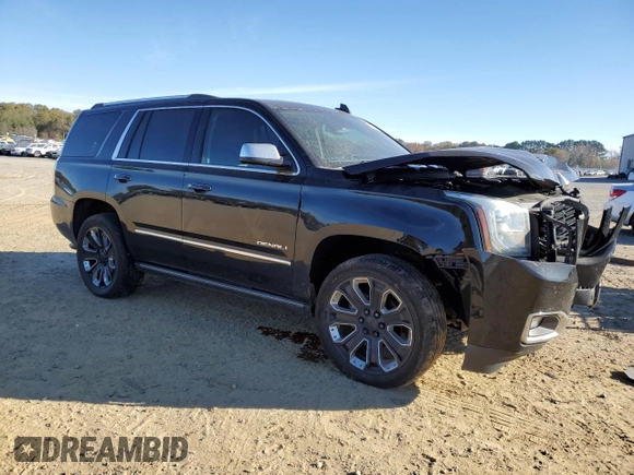 2018 GMC Yukon Denali with VIN 1GKS2CKJ3JR404177, listed as a Copart auction lot 82577354 with 129,744 mi miles and Salvage Title. Bid and sale history available at carsss.com. Image 4.