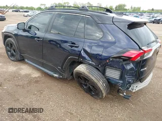2021 Toyota RAV4 Hybrid XSE with VIN 4T3E6RFV0MU053245, listed as a IAAI auction lot 42426959 with 28,717 mi miles and . Bid and sale history available at DreamBid. Image 3.