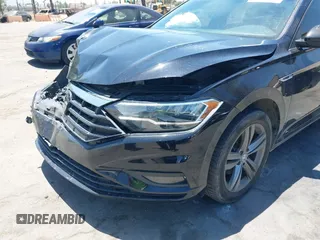2019 Volkswagen Jetta S z VIN 3VWC57BU1KM116991, wystawiony jako IAAI lot #42377777 z przebiegiem 70 910 mil mil oraz . Historia ofert i sprzedaży dostępna na DreamBid. Obrazek 17.