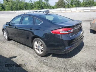 2018 Ford Fusion SE z VIN 3FA6P0HD9JR157594, wystawiony jako Copart lot #55539515 z przebiegiem 164 403 mil mil oraz Czysty tytuł • Clean title. Historia ofert i sprzedaży dostępna na DreamBid. Obrazek 2.