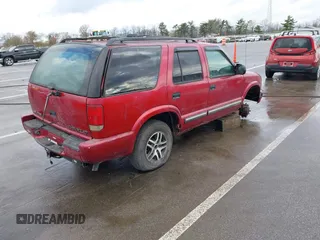 2000 Chevrolet Blazer LT z VIN 1GNDT13W9Y2133636, wystawiony jako IAAI lot #42066871 z przebiegiem Nie podano mil oraz . Historia ofert i sprzedaży dostępna na DreamBid. Obrazek 4.