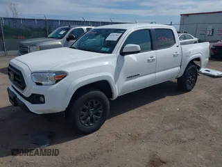 2023 Toyota Tacoma SR with VIN 3TMCZ5AN2PM642205, listed as a IAAI auction lot 42167945 with 10,595 mi miles and . Bid and sale history available at DreamBid. Image 2.