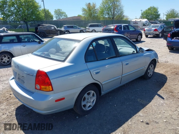 2005 Hyundai Accent GLS with VIN KMHCG45C75U658672, listed as a IAAI auction lot 42107140 with 34,351 mi miles. Bid and sale history available at carsss.com. Image 4.
