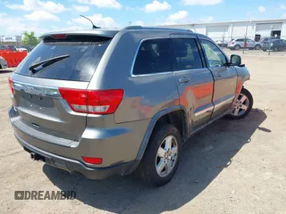 2011 Jeep Grand Cherokee Laredo with VIN 1J4RR4GGXBC587911, listed as a IAAI auction lot 42156885 with 178,999 mi miles and . Bid and sale history available at DreamBid. Image 4.