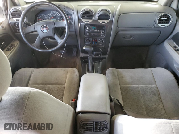 2005 GMC Envoy SLE with VIN 1GKDS13S852374516, listed as a Copart auction lot 42409725 with 299,816 mi miles and Salvage Title. Bid and sale history available at carsss.com. Image 8.