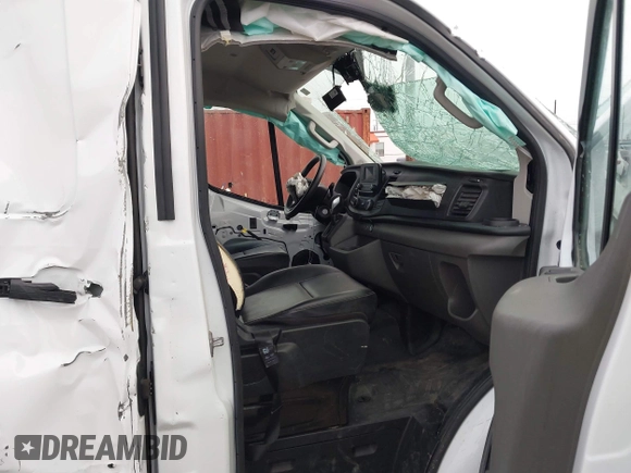 2023 Ford Transit Cargo with VIN 1FTYE1Y82PKB92413, listed as a IAAI auction lot 41702808 with 20,144 mi miles and . Bid and sale history available at DreamBid. Image 5.
