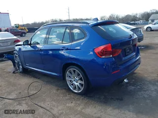 2015 BMW X1 sDrive28i with VIN WBAVM1C58FV314947, listed as a IAAI auction lot 41874472 with 128,271 mi miles. Bid and sale history available at carsss.com. Image 3.