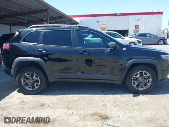 2019 Jeep Cherokee Trailhawk Elite with VIN 1C4PJMBX0KD198328, listed as a IAAI auction lot 42085194 with 76,312 mi miles and . Bid and sale history available at DreamBid. Image 14.