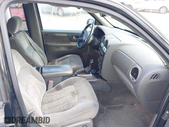 2002 GMC Envoy SLE z VIN 1GKDS13S922523317, wystawiony jako IAAI lot #42374259 z przebiegiem 185 686 mil mil oraz . Historia ofert i sprzedaży dostępna na DreamBid. Obrazek 5.
