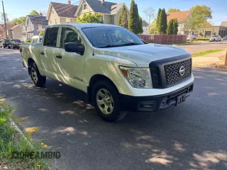 2017 Nissan Titan SV with VIN 1N6AA1EK5HN530011, listed as a Copart auction lot 57471455 with 216,992 mi miles and Clean title. Bid and sale history available at DreamBid. Image 2.