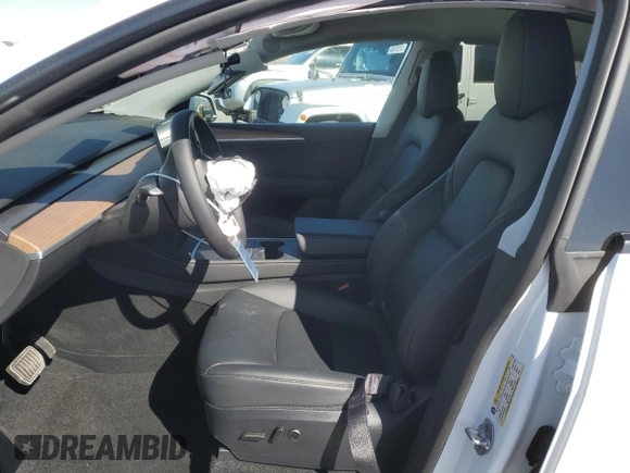 2025 Tesla Model Y Long Range with VIN 7SAYGDED2SA373756, listed as a Copart auction lot 49866835 with 3,318 mi miles and Salvage Title. Bid and sale history available at DreamBid. Image 7.