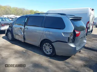 2015 Toyota Sienna XLE with VIN 5TDYK3DC0FS558486, listed as a IAAI auction lot 42064281 with 211,119 mi miles and . Bid and sale history available at DreamBid. Image 3.