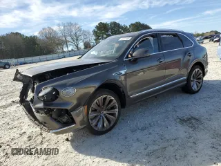 2023 Bentley Bentayga z VIN SJAAT2ZV3PC021960, wystawiony jako Copart lot #49707455 z przebiegiem Nie podano mil oraz Szkoda całkowita • Salvage title. Historia ofert i sprzedaży dostępna na DreamBid. Obrazek 1.