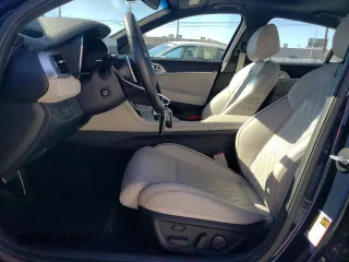 2023 Genesis G70 3.3T with VIN KMTG54TE2PU123852, listed as a Copart auction lot 77562964 with 10,890 mi miles and Salvage Title. Bid and sale history available at carsss.com. Image 7.